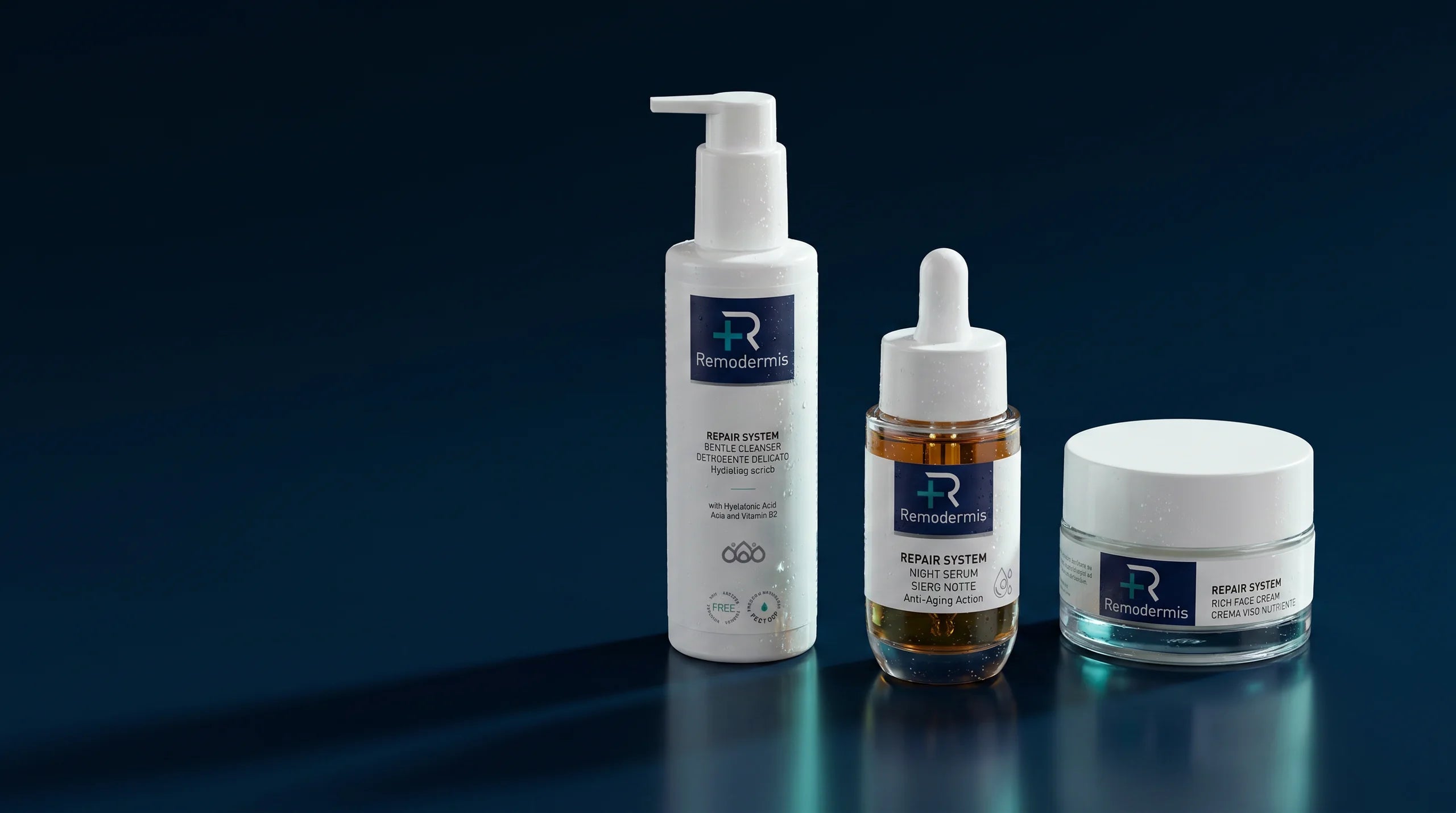 Remodermis Repair System - detergente, siero e crema su fondo navy